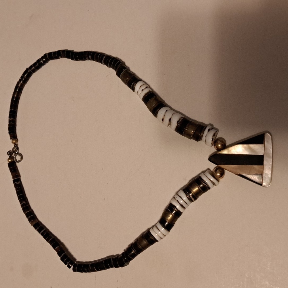 Mother of pearl shells and metal necklace. 18 inches